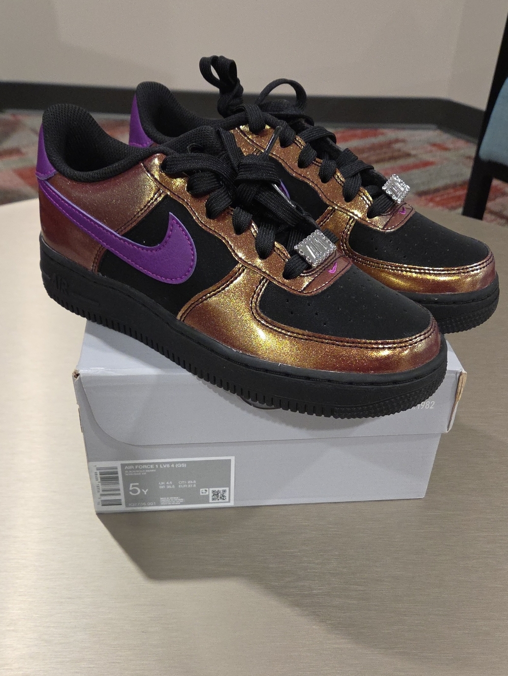 Nike Kids Black with Iridescent Bronze-Gold and Purple Swoosh Sneakers